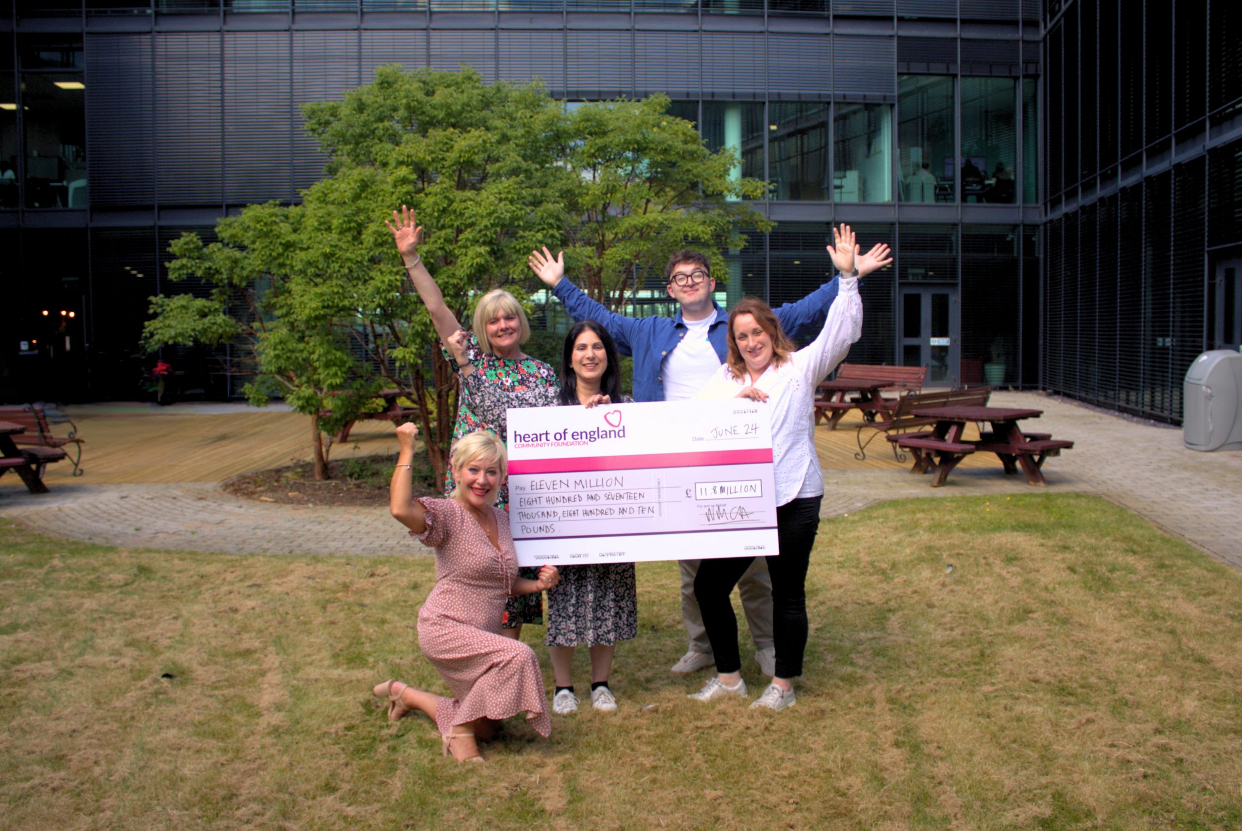 Photo including Tina Costello OBE, Jayne Taylor-Farren, Shamiela Ahmed, Ryan Boyce and Helen Kendrick from Heart of England Community Foundation holding £11.8m big cheque